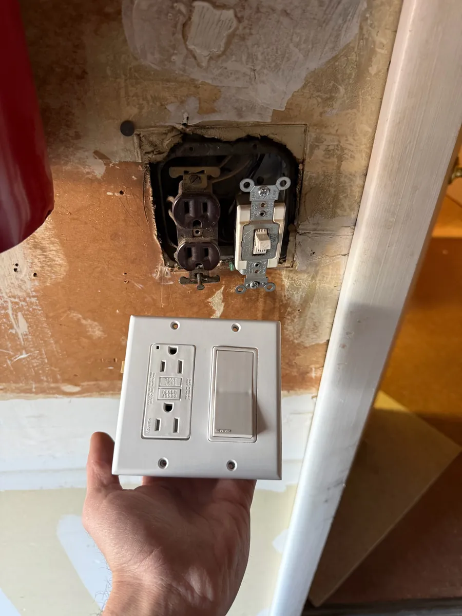 Old worn outlet before replacement